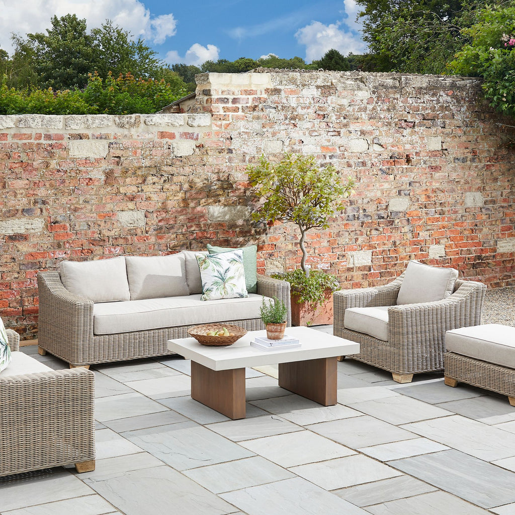 Capri Collection Outdoor Armchair in a garden 