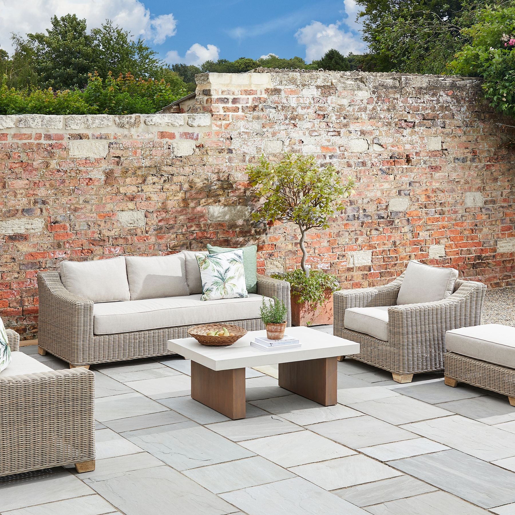 Capri Collection Outdoor Armchair in a garden 