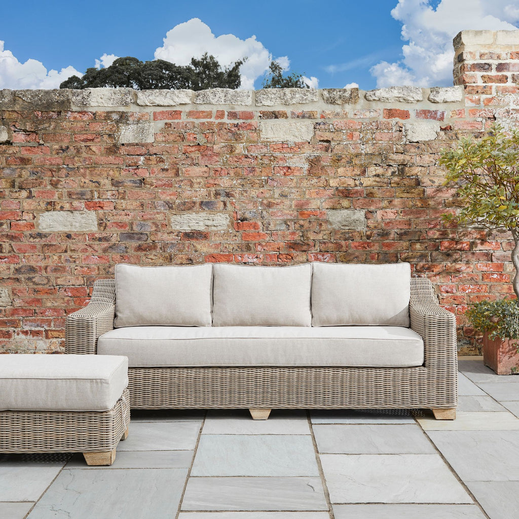 Capri Collection Outdoor Three Seater Sofa in garden